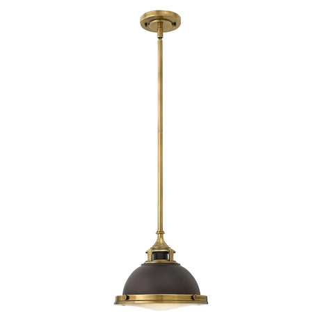 The Amelia 1 Light Mini Pendant - Bronze showcases a bronze finish with a dark dome-shaped shade and an opal glass bottom, gracefully suspended from a matching bronze rod and ceiling mount.