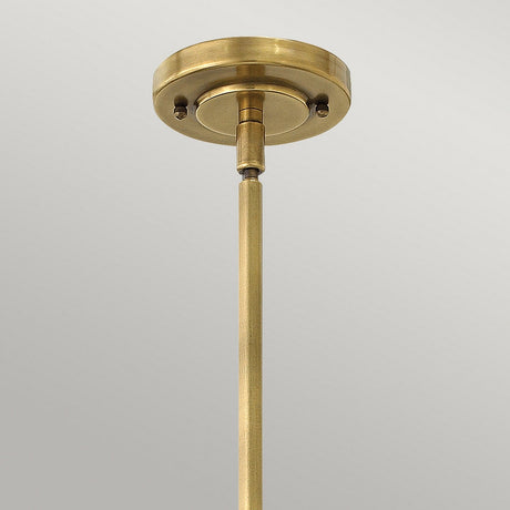 Close-up of the Amelia 1 Light Mini Pendant - Bronze, highlighting a bronze ceiling light fixture with an opal glass dome and a rod extending downwards against a plain gray background. The fixture features a circular mount with a simple, elegant design.