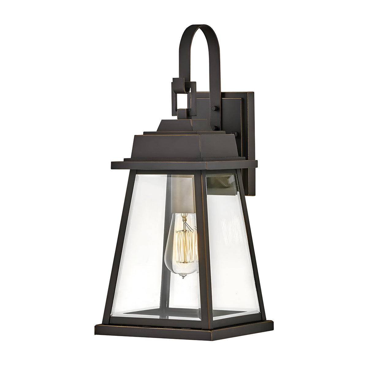 The Bainbridge 1 Light Outdoor Medium Wall Lantern in bronze features bevelled glass panels and a visible filament bulb, designed in a classic rectangular shape with a slightly sloped top and an attached wall mounting bracket, adding timeless elegance to any exterior space.