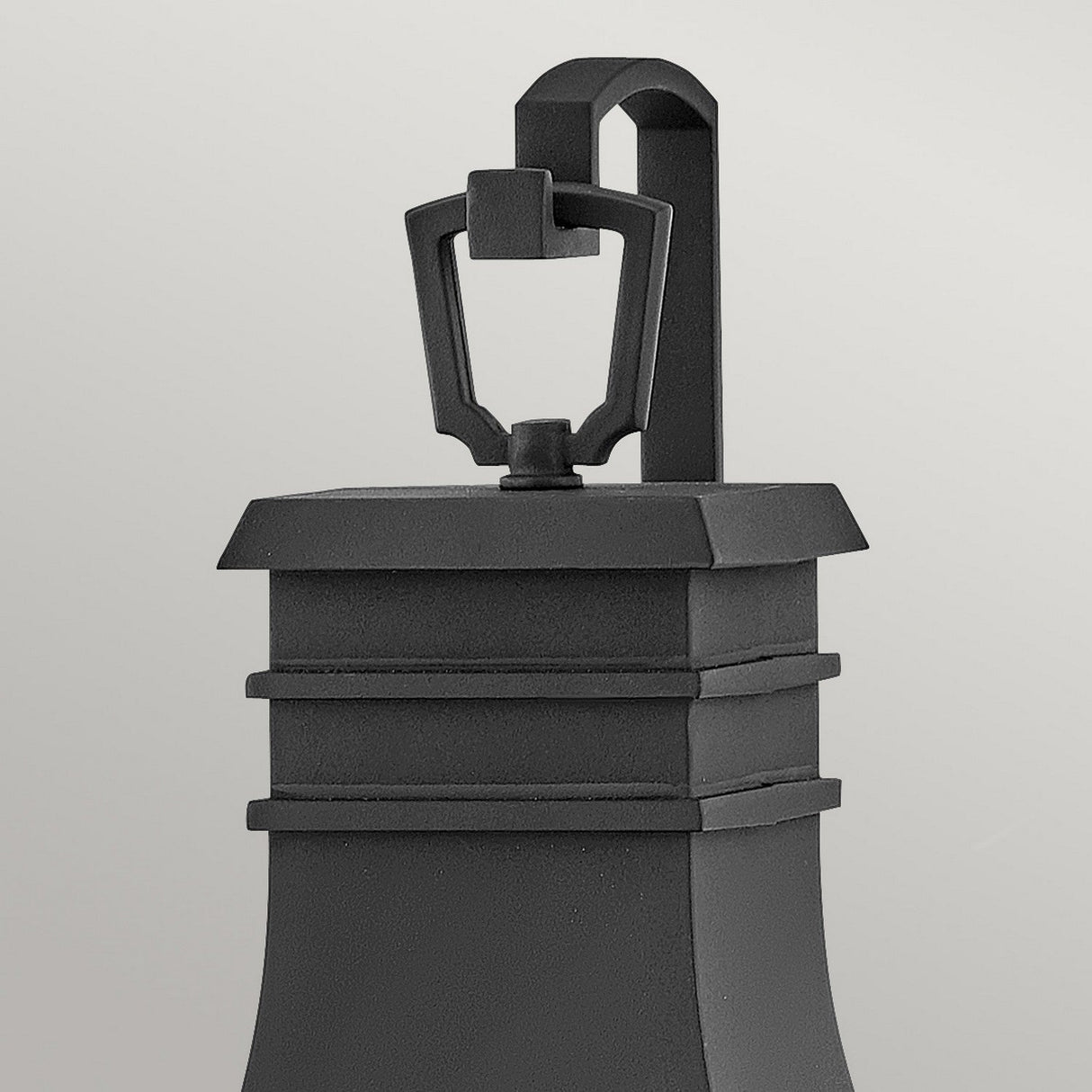 A close-up of a Beacon Hill 2 Light Outdoor Medium Wall Lantern in black, featuring its rectangular frame and stylish metal handle at the top, set against a plain gray background.