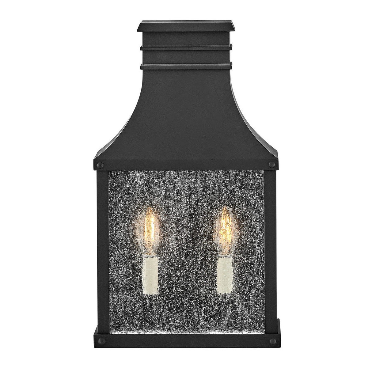 The Beacon Hill 2 Light Outdoor Half Wall Lantern - Black is designed with a black metal frame and a rectangular shape, featuring two candle-shaped bulbs that emit a warm glow. Its Museum Black Aluminum Frame paired with textured glass panels beautifully enhances the soft lighting, making it an ideal choice for outdoor spaces.