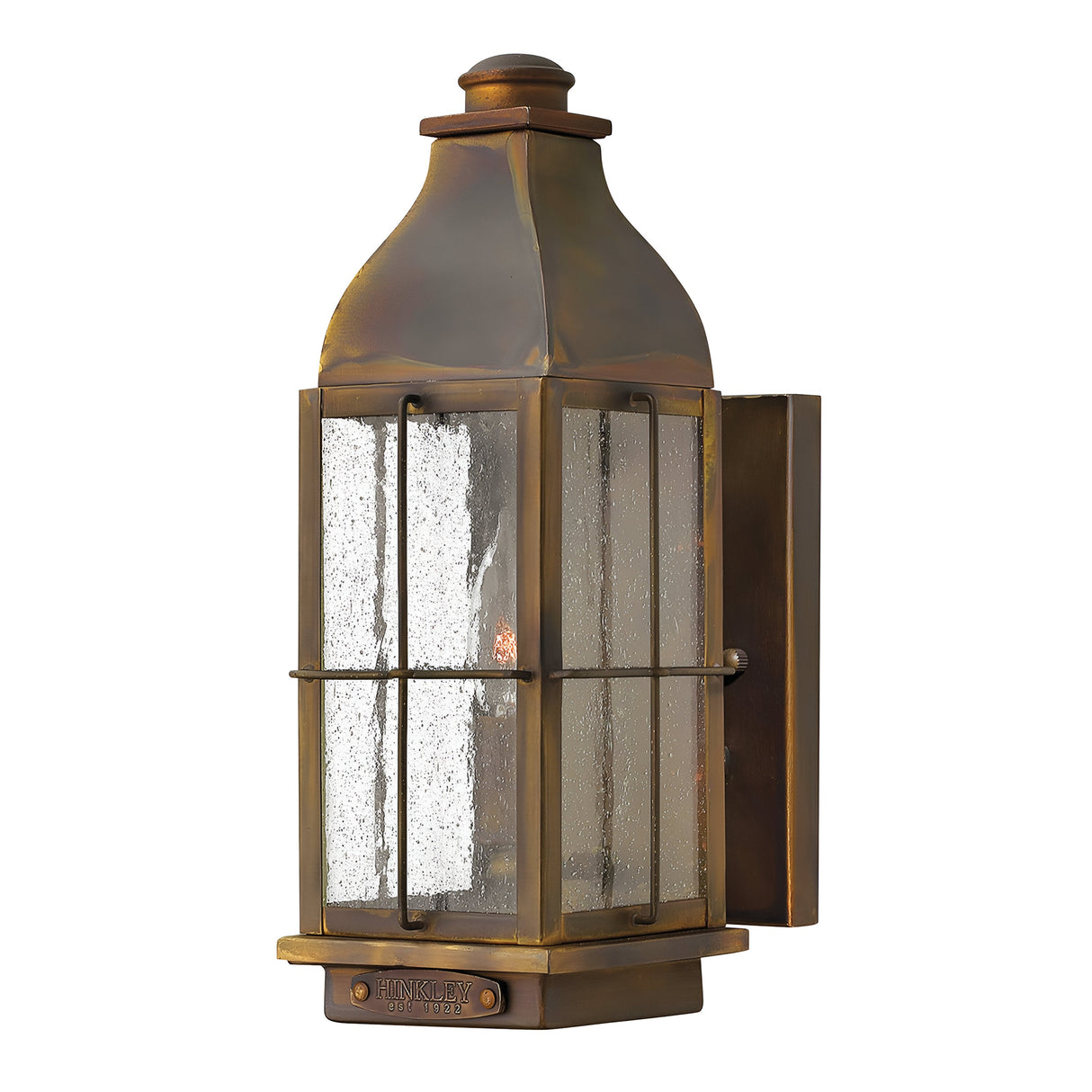The Bingham 1 Light Outdoor Small Wall Lantern in brown features a vintage-style design with a bronze finish and clear glass panels, showcasing nautical influences. Its rectangular metal frame with a visible bulb enhances its antique charm.