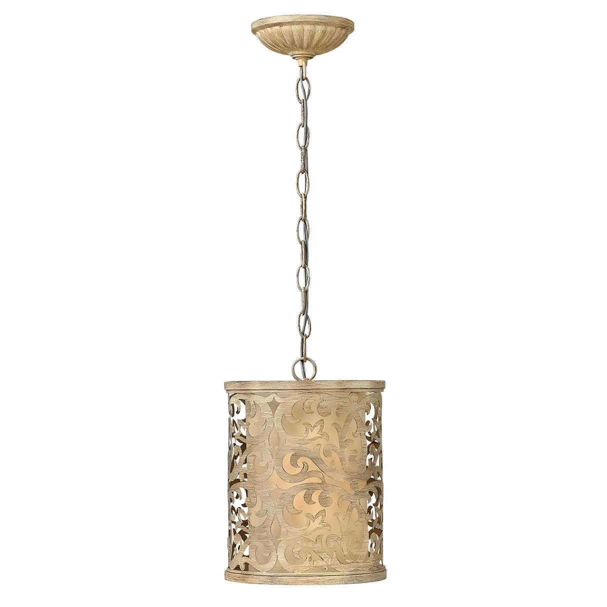The Carabel 1 Light Mini Pendant in Brushed Champagne is a decorative fixture featuring a pierced metalwork, cylindrical shade with intricate scrollwork designs. It is suspended by a chain and has a warm, vintage finish.