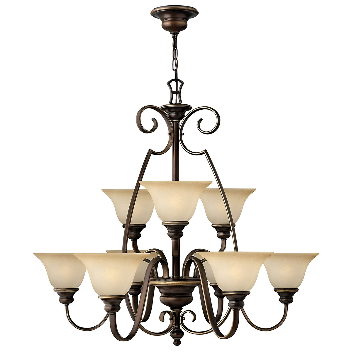 The Cello 9 Light Chandelier in Antique Bronze is a sophisticated piece with two tiers, designed with nine upward-facing faux alabaster glass shades, each elegantly held by curved metal arms. The chandelier is suspended from a linked chain and showcases a classic, ornate design.