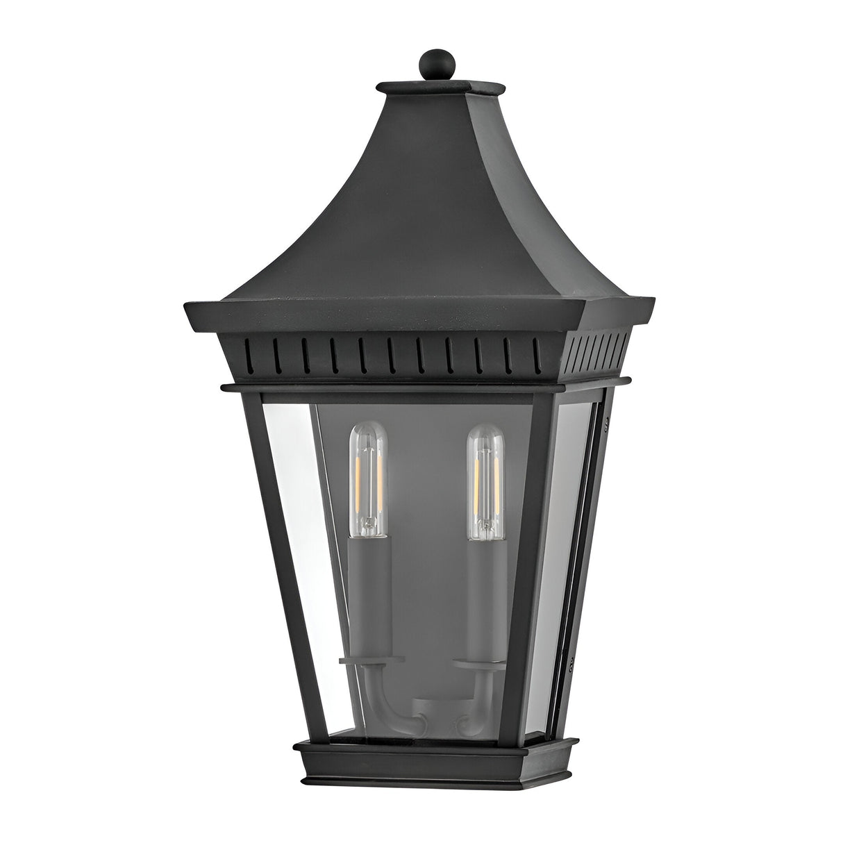The Chapel Hill 2 Light Outdoor Half Wall Lantern in black features a traditional carriage house design with a pointed top, clear glass panels, and two visible LED bulbs.