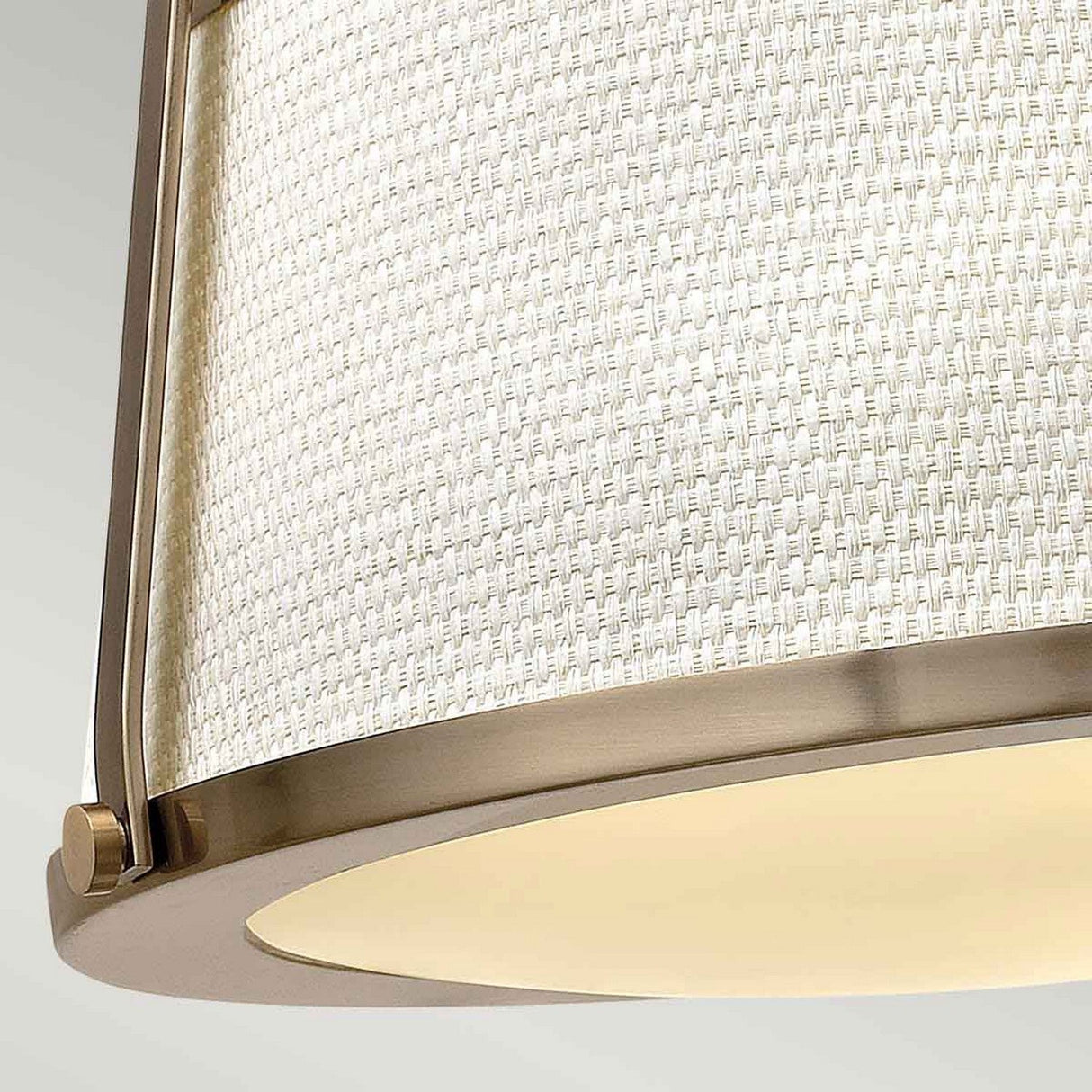 Close-up of the Charlotte 3 Light Semi Flush, featuring a linen shade with a textured pattern. This pendant light is supported by a metal frame in a brushed gold finish, offering a modern and elegant look.