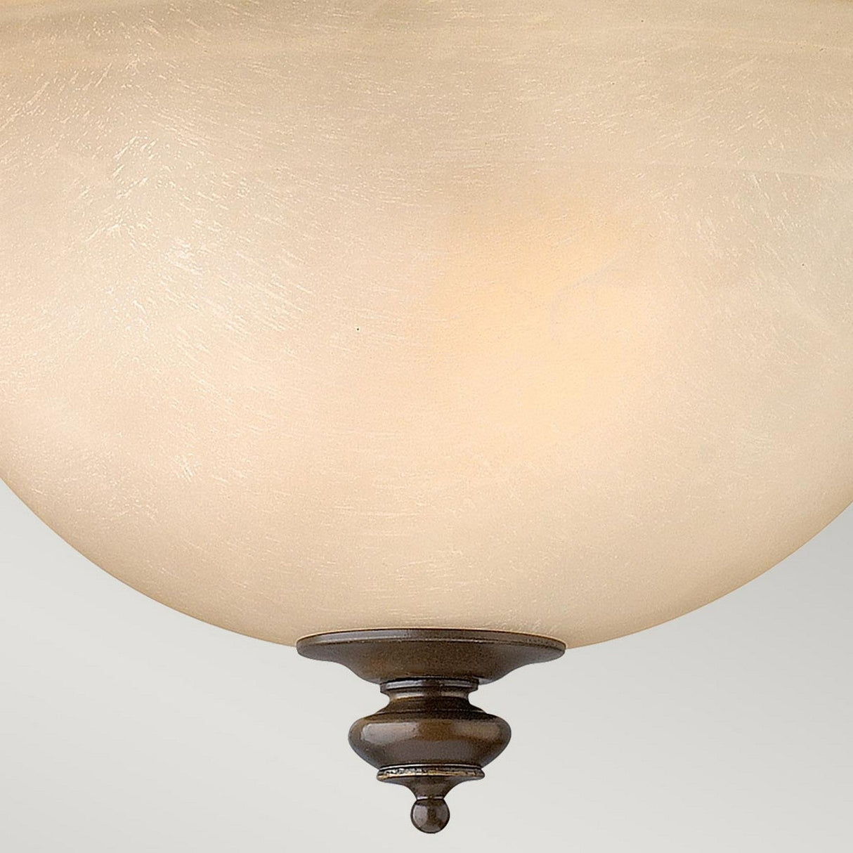 The Dunhill 2 Light Semi Flush - Bronze showcases a close-up of its semi-flush ceiling light fixture, featuring a frosted glass dome shade. The dark bronze base, designed with a decorative finial, exudes vintage-inspired elegance against a neutral background.
