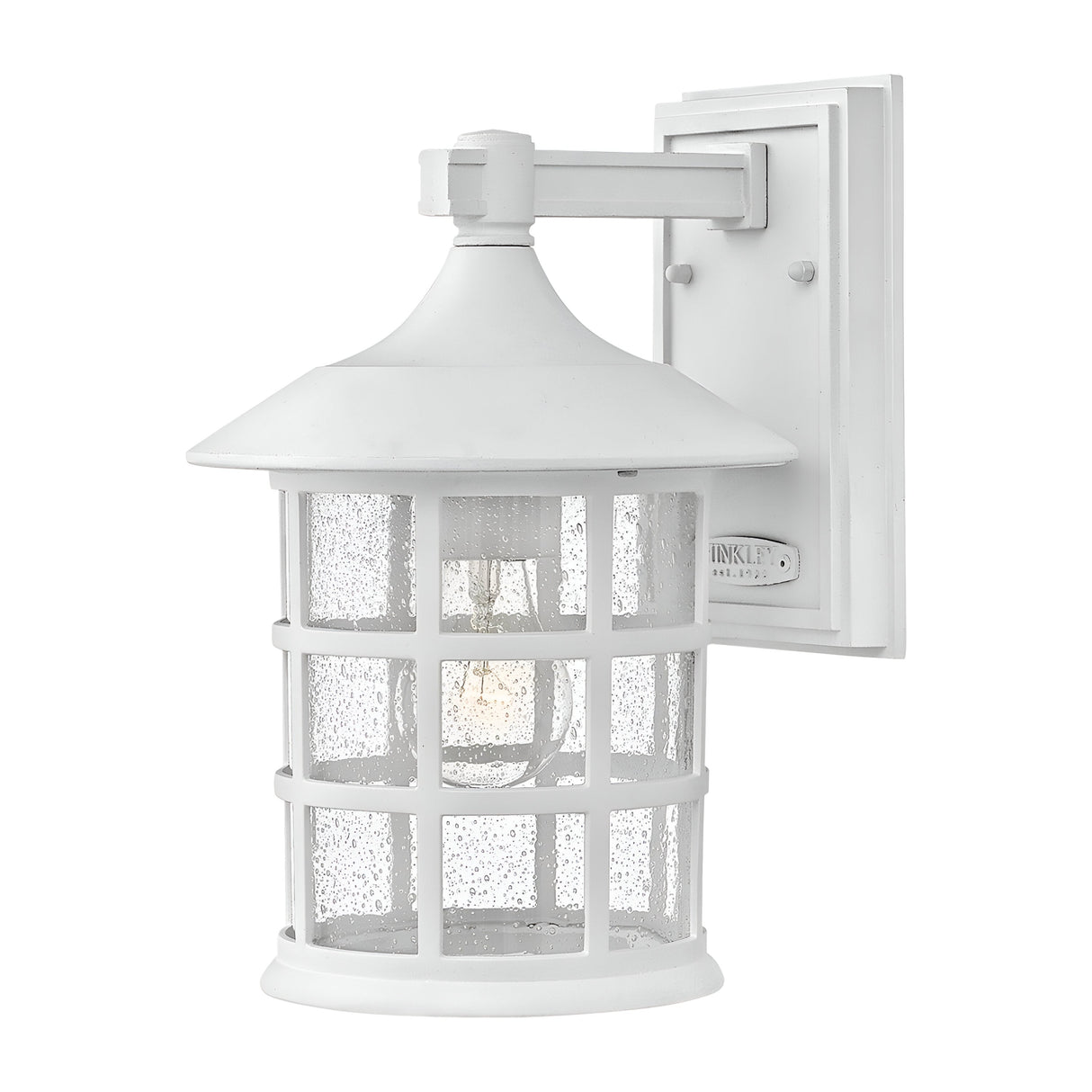 The Freeport 1 Light Outdoor Medium Wall Lantern in white showcases a clear seeded glass shade and grid design, mounted on a rectangular backplate, allowing the light bulb to be beautifully visible through the textured glass.