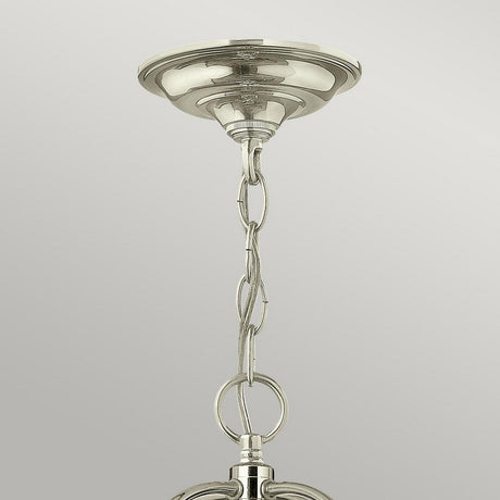 A close-up of the Gentry 6 Light Large Pendant - Polished Nickel shows its polished nickel chandelier chain connected to a ceiling mount. The chain features large, linked metal loops with a shiny, reflective finish set against a light gray background.