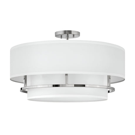 Introducing the Graham 4 Light Duo-Mount Pendant/Semi-Flush, featuring a modern ceiling light design with a circular white fabric shade and sleek polished nickel accents. Its dual-mount capability ensures versatility, while the semi-flush design offers a contemporary aesthetic by combining soft textures with polished metal finishes.