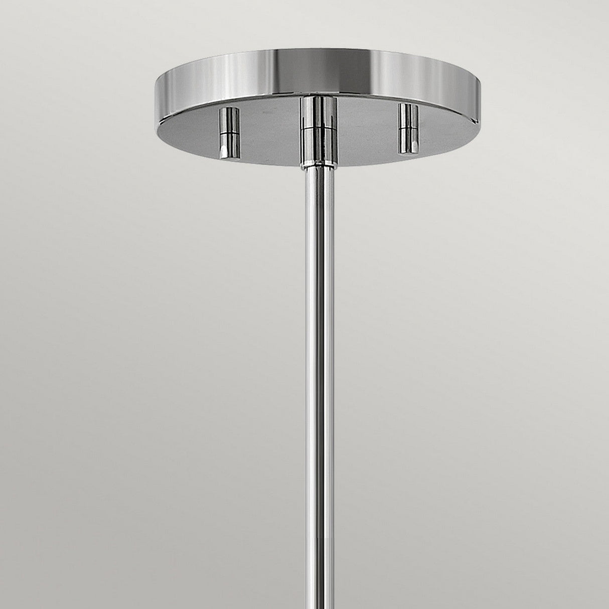 A close-up of the Graham 3 Light Duo-Mount Pendant/Semi-Flush in polished nickel, featuring a sleek, cylindrical design. The fixture is mounted on a smooth, round ceiling plate and extends downward. The background is a neutral light gray.