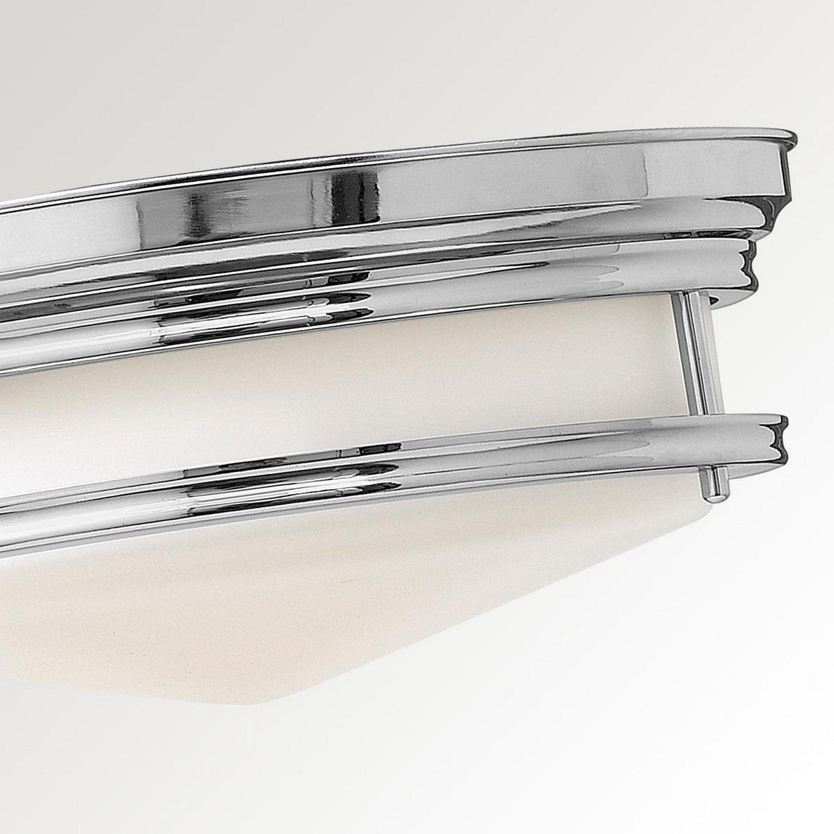 Close-up of the modern Hadley 3 Light Flush - Chrome ceiling fixture, featuring a sleek chrome finish and an etched opal glass shade. The design showcases clean lines and a contemporary aesthetic, adding elegance to any room.