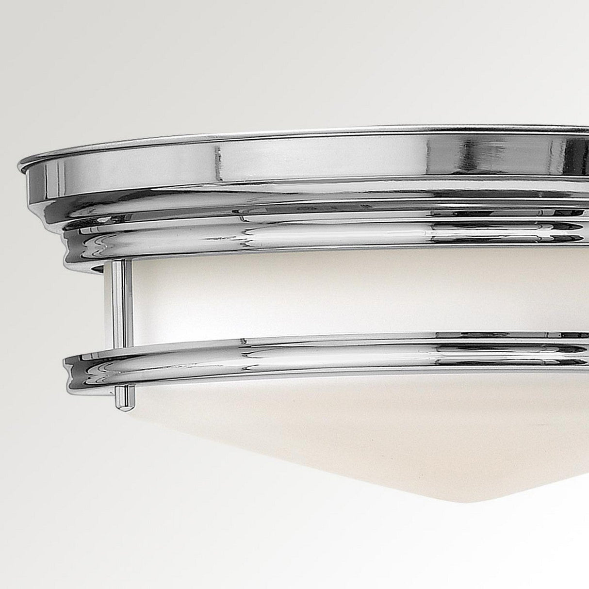 The Hadley 3 Light Flush - Chrome is a contemporary circular fixture featuring an etched opal glass shade, beautifully captured against a simple off-white backdrop.