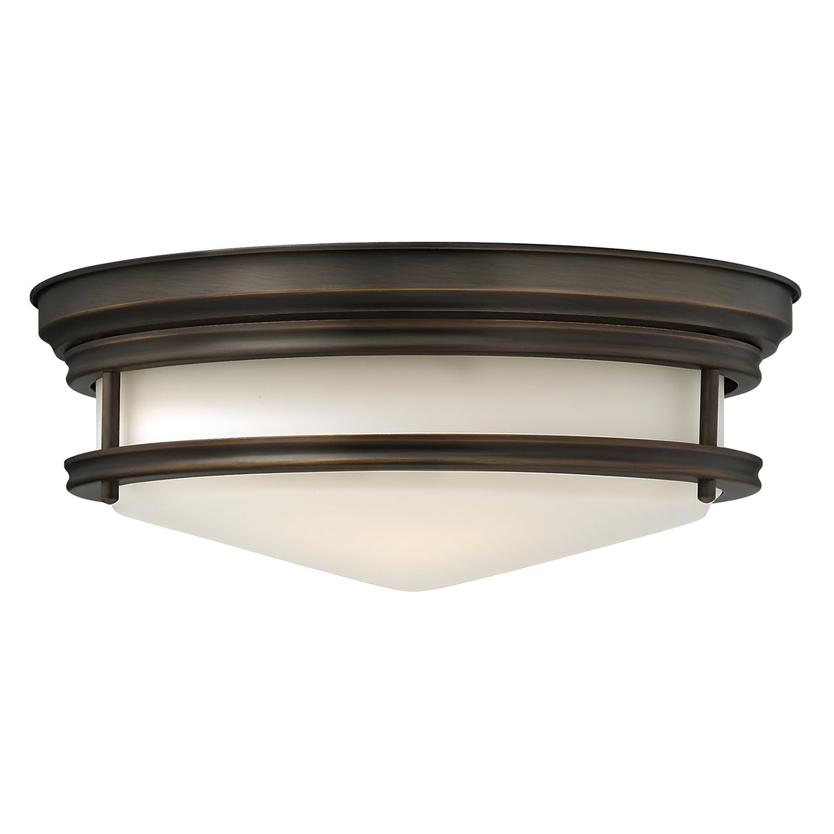 The Hadley 3 Light Flush - Bronze is a ceiling fixture with a bronze finish and a frosted glass shade. Its retro design showcases two concentric bronze rings encircling the white dome, offering a modern and elegant look.