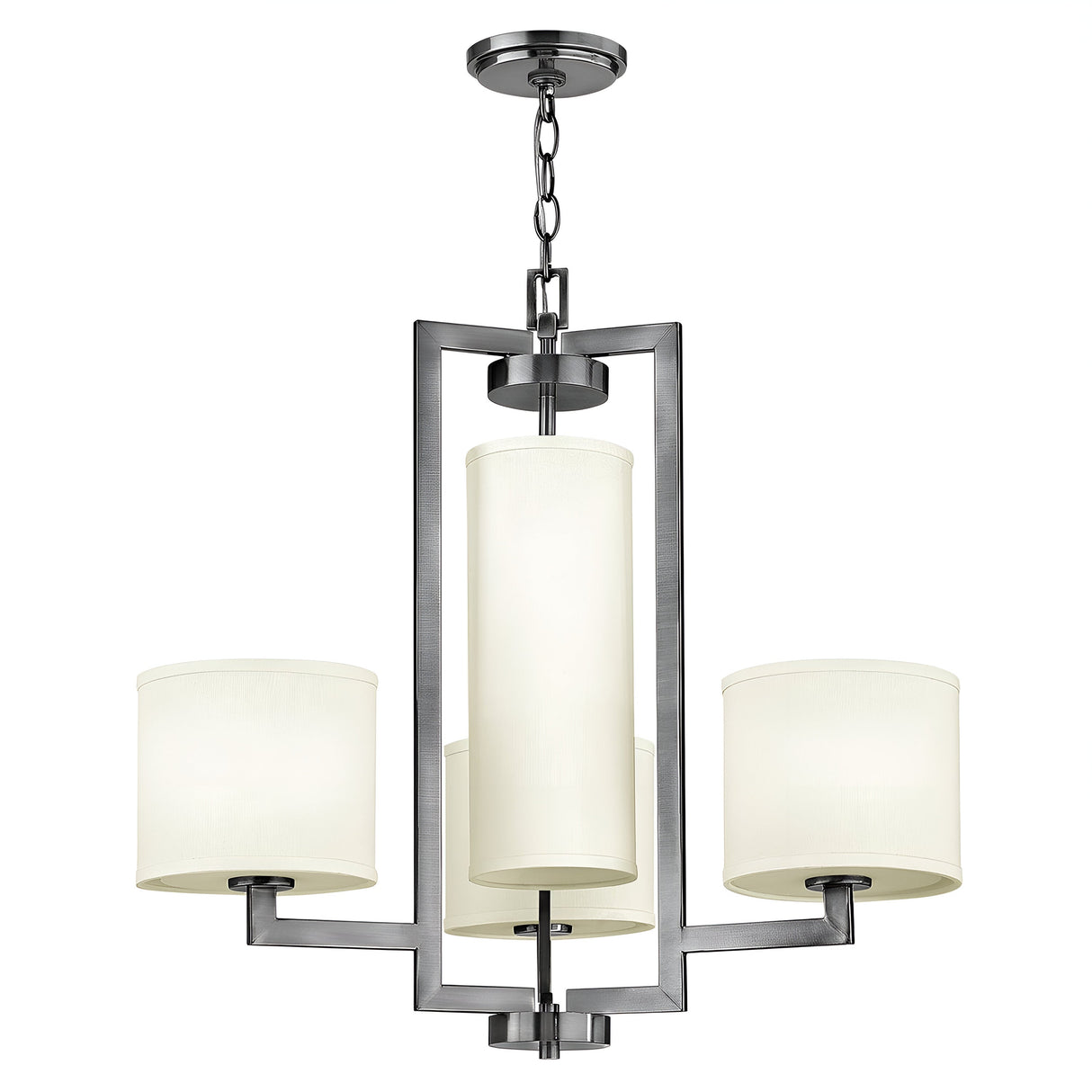 The Hampton 4 Light Chandelier - Antique Nickel with Ivory Shade showcases a contemporary, transitional design featuring three cylindrical ivory lampshades. These shades are arranged in a triangular formation and suspended by a chain from a rectangular frame. The central shade is larger, contributing an elegant touch to the fixture's overall appearance.