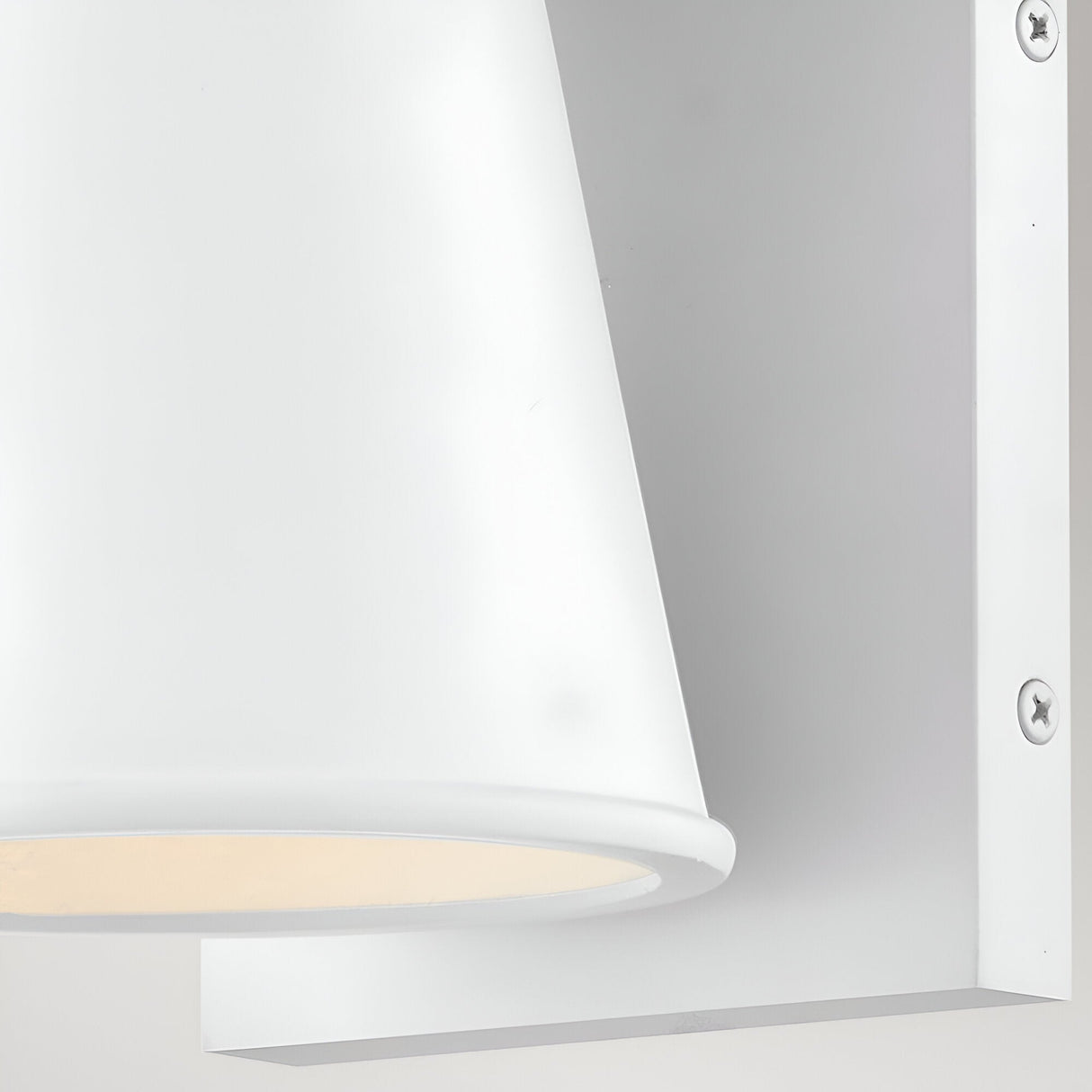 Close-up of the Coastal 1 Light Small Outdoor Wall Lantern in textured white—a modern fixture with a conical shade, rectangular mounting plate, and visible right-side screws.