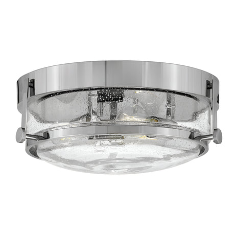 The Harper 3 Light Flush in polished chrome with clear seeded glass showcases delicate bubble-like details. Its sleek design exudes contemporary elegance, making it an ideal choice for various interior settings.