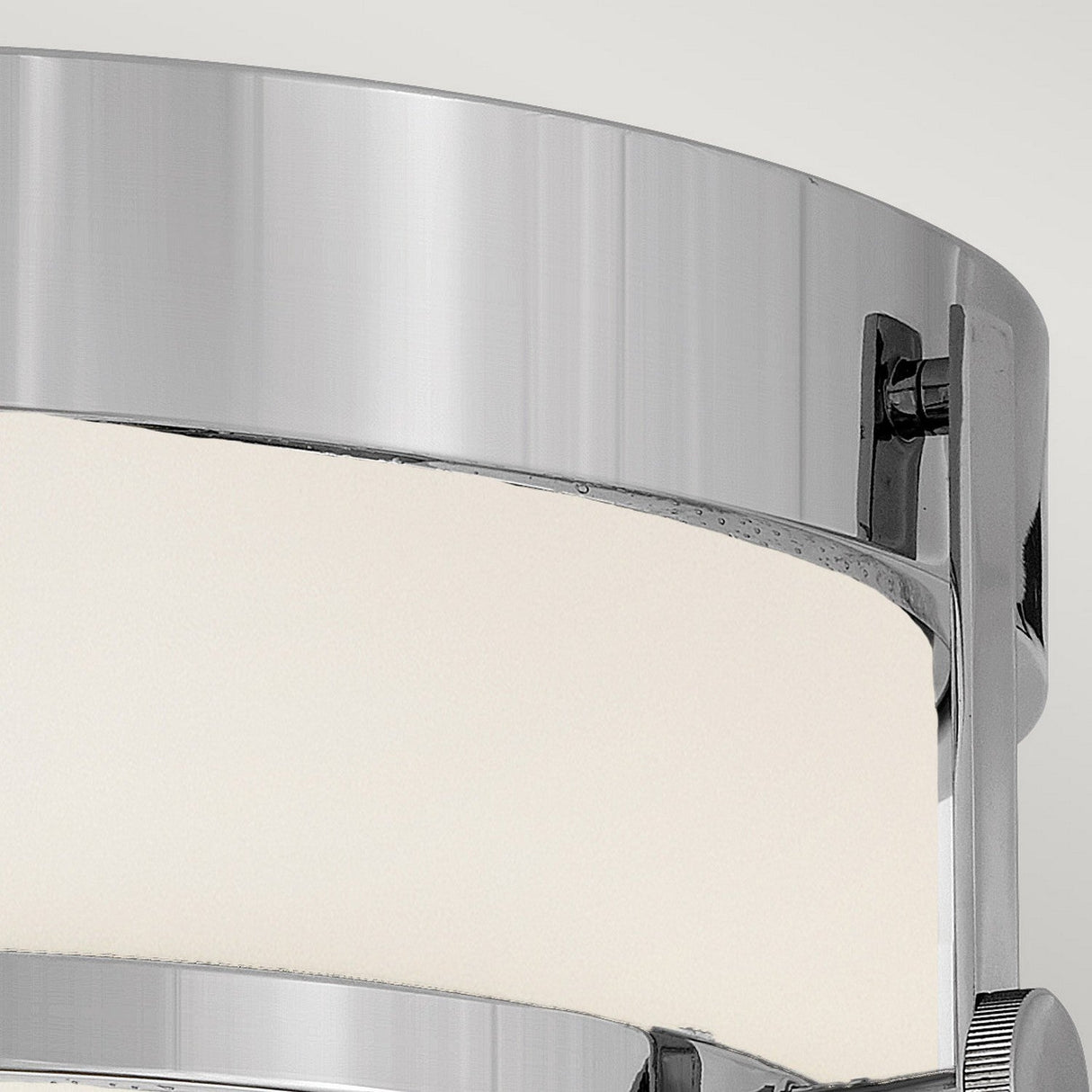 Close-up of the Harper 3 Light Flush - Polished Chrome With Opal Etched Glass, showcasing its minimalist design with polished chrome accents and an opal etched glass shade. This modern circular ceiling fixture seamlessly combines sleek style with functionality.