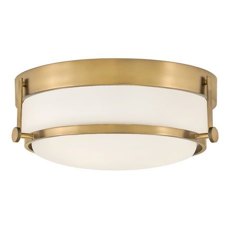The Harper 3 Light Flush, with its heritage brass frame and opal etched glass, showcases a circular design and minimalistic style, offering the elegance and sophistication of flush mount lighting.