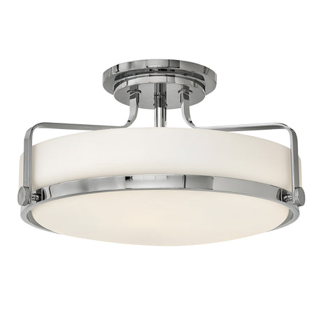 The Harper 3 Light Medium Semi Flush features a contemporary and minimalist design with an opal etched glass shade encased in a sleek polished chrome frame, mounted with a short matching rod.