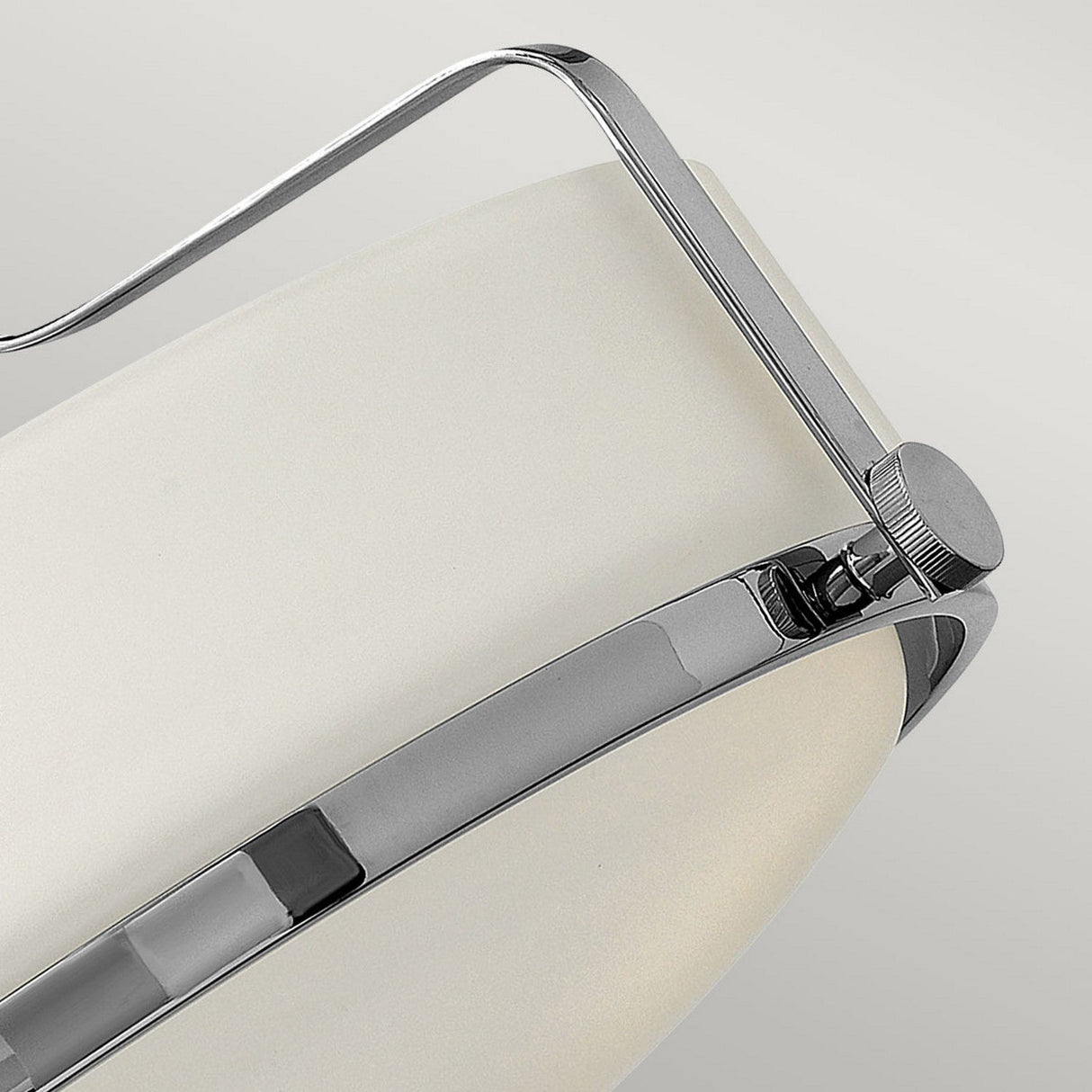 A close-up of the Harper 3 Light Small Semi Flush lamp highlights its polished chrome arm and adjustment knob, beautifully contrasted with an opal etched glass shade against a light gray background.