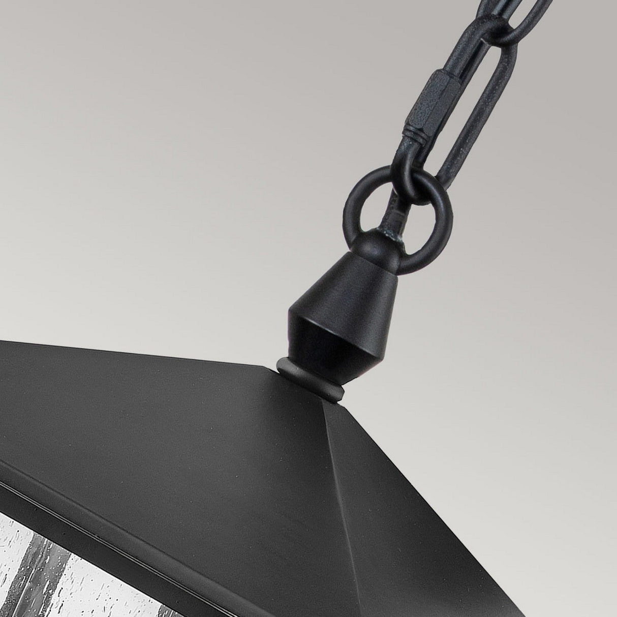 Close-up of the Huntersfield Outdoor 3 Light Large Chain Pendant in a black finish, featuring a decorative chain and sloped metal top, highlighting its elegant three-light design against a neutral background.