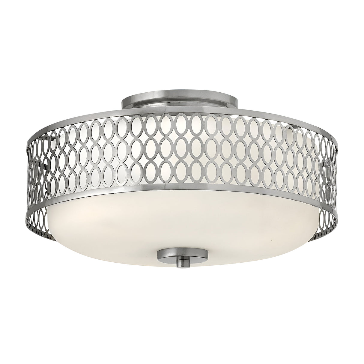 The Jules 3 Light Flush in brushed nickel showcases a sleek, modern design with a frosted glass dome encased in decorative metal mesh adorned with circular cutouts, ideal for contemporary lighting.