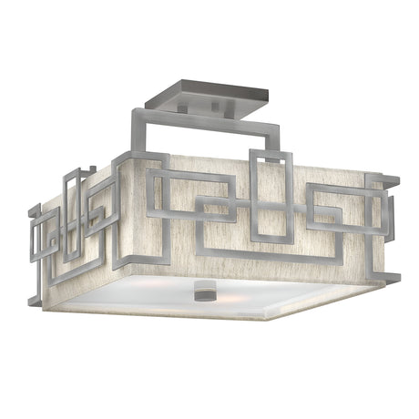 Introducing the Lanza 3 Light Semi Flush - Antique Nickel: a modern square ceiling light fixture with a sophisticated design. It features a geometric metal frame composed of overlapping rectangular shapes and is complemented by a frosted glass cover. The Antique Nickel finish adds to its contemporary style, providing a sleek and stylish appearance.