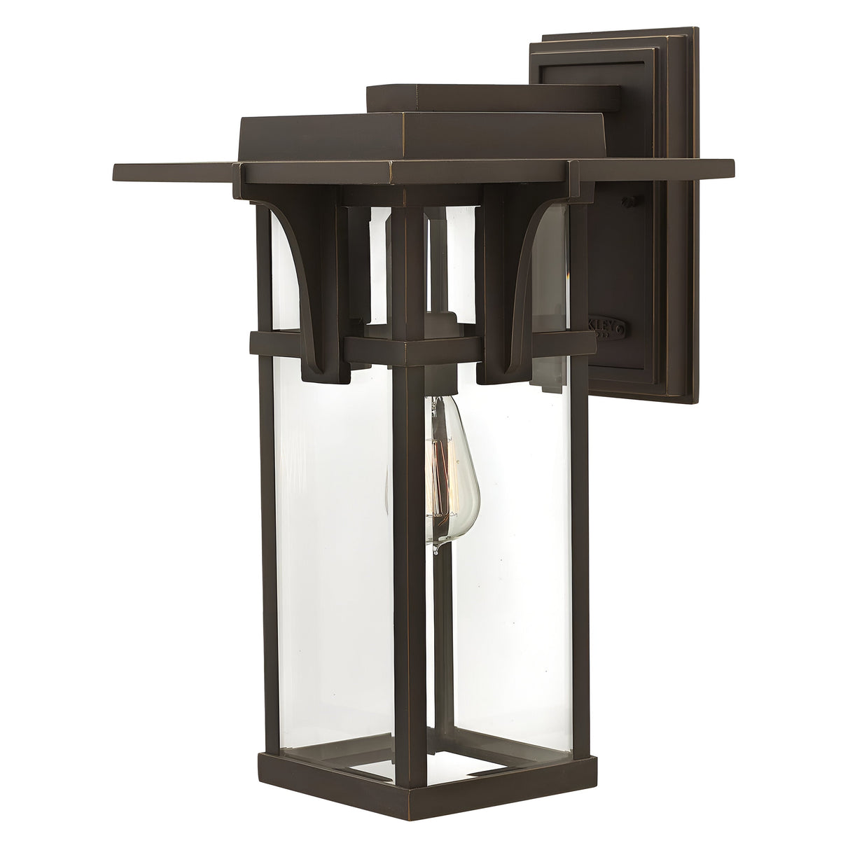 Introducing the Manhattan Outdoor 1 Light Large Wall Lantern in Oil Rubbed Bronze: This vintage-style outdoor wall lantern features a rectangular metal frame with a sophisticated oil-rubbed bronze finish and clear glass panels. Inside, a vintage-style bulb is mounted on a sturdy square backplate, enhancing the charm and elegance of any exterior space.