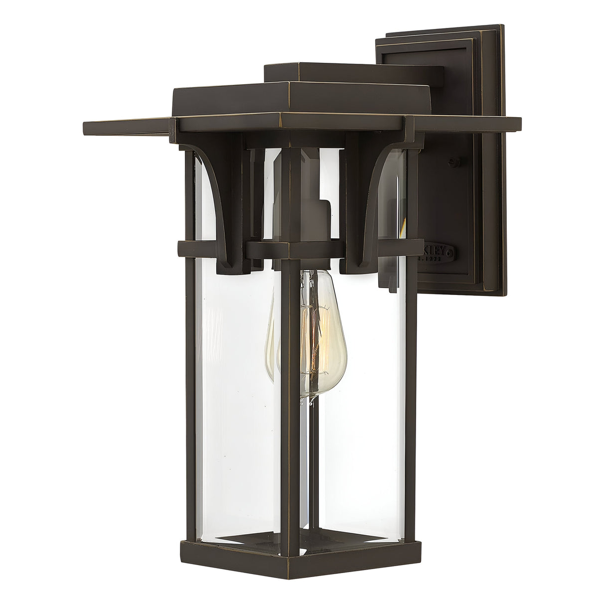 The Manhattan Outdoor 1 Light Medium Wall Lantern in oil rubbed bronze showcases a rectangular frame with clear glass panels and offers an IP44 rating. This wall lantern accommodates a single vintage-style bulb, combining modern design with classic elements for charming exterior lighting.