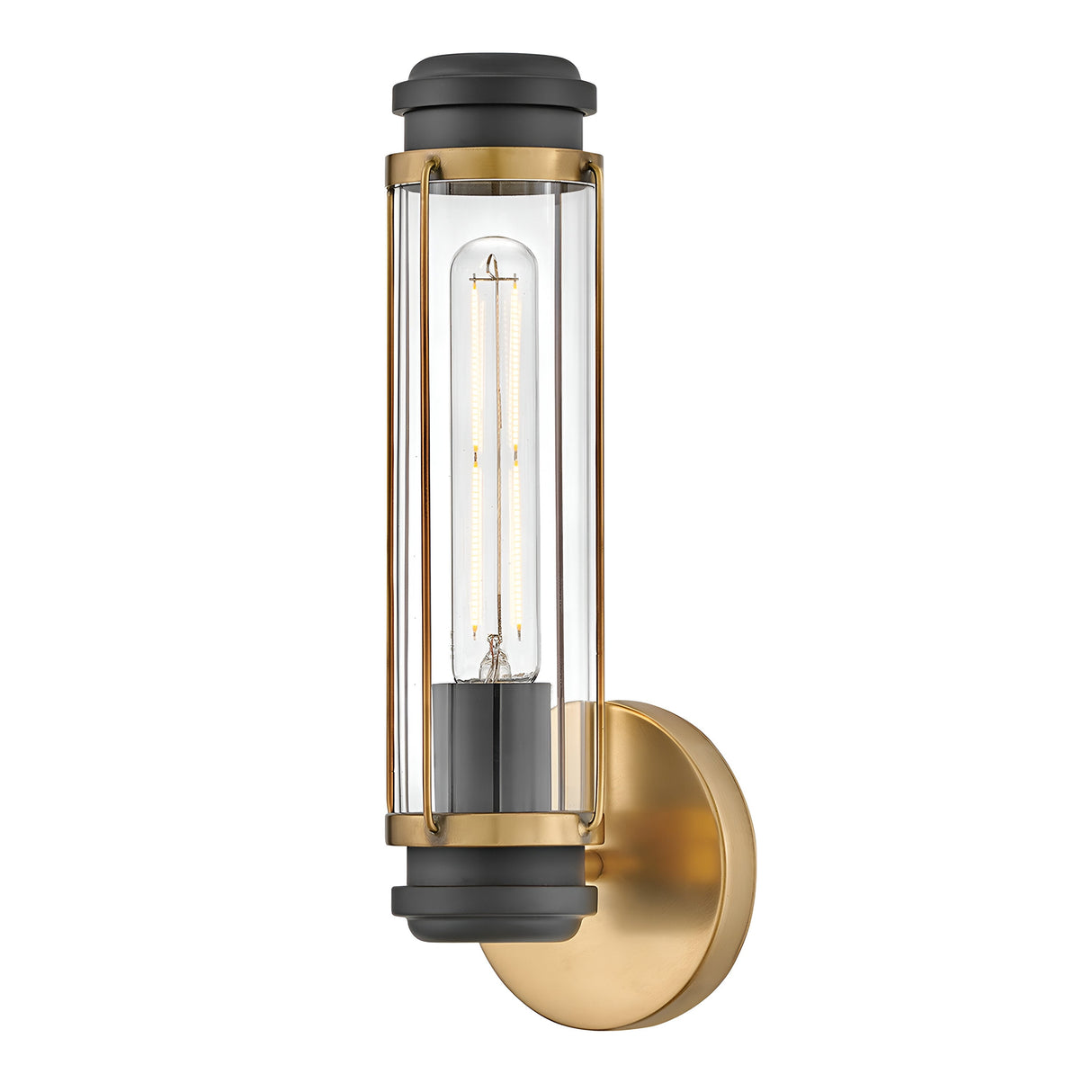 The Masthead 1 Light Wall Light in Heritage Brass and Black features a contemporary metal frame in gold and black, with a clear glass tube encapsulating an exposed LED bulb for a touch of nautical charm. It is beautifully mounted on a circular gold base.