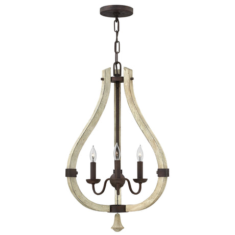 The Middlefield 3 Light Chandelier - Iron Rust features a rustic chic design with a teardrop-shaped distressed wood frame that houses three candle-like lights. It is suspended from a dark metal chain with an iron rust finish, blending vintage and industrial design elements.