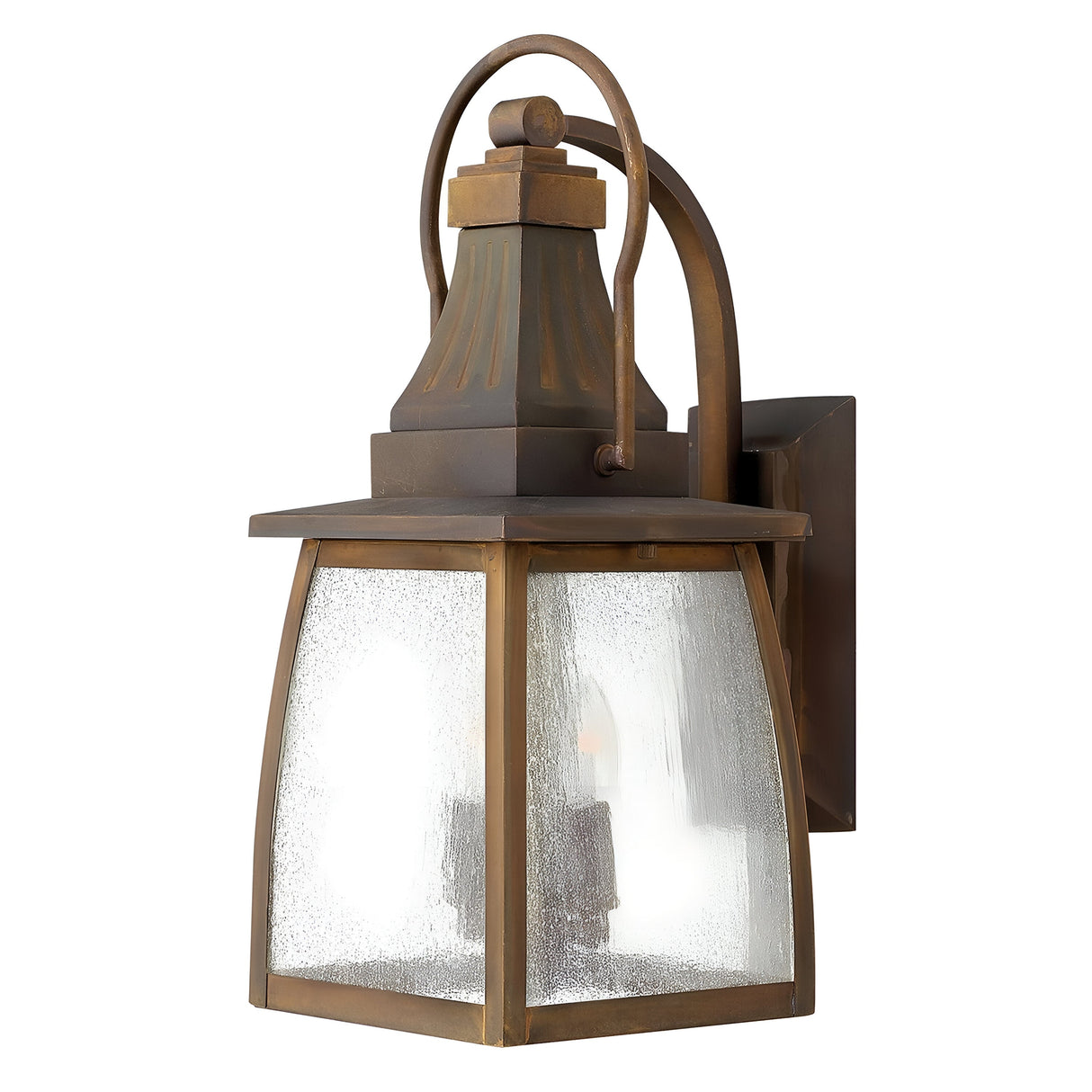 The Montauk 2 Light Small Wall Lantern - Sienna is a rustic outdoor fixture flaunting a Sienna finish. This weathered square frame, made from solid brass, is complemented by frosted glass panels. With a loop handle on top, it elegantly mounts on a square backplate for timeless charm.