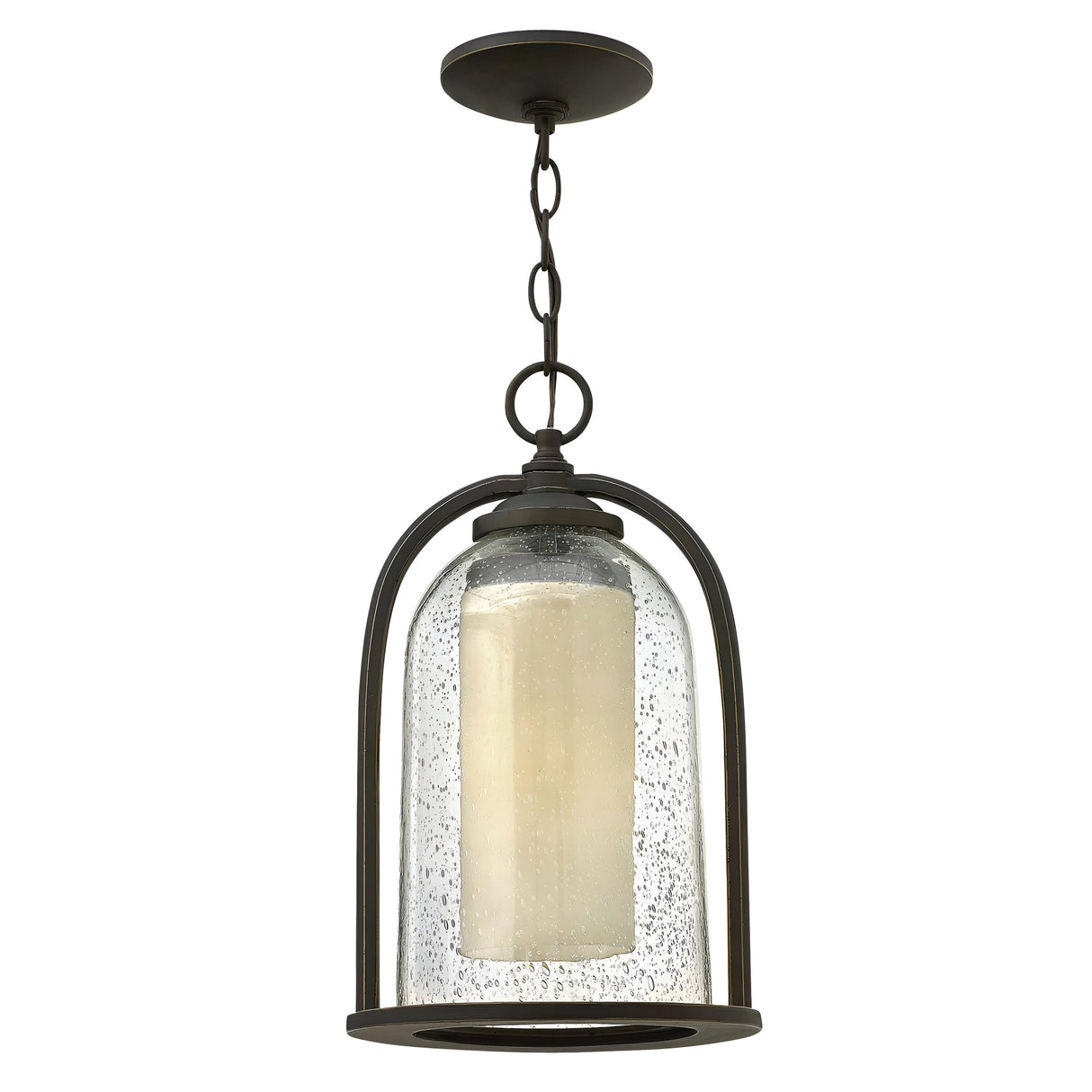 The Quincy Outdoor 1 Light Medium Chain Pendant in Oil Rubbed Bronze presents a captivating blend of rustic and modern design elements, featuring a seedy outer glass shade that encases a candle-like LED light. This fixture is elegantly suspended by a chain.