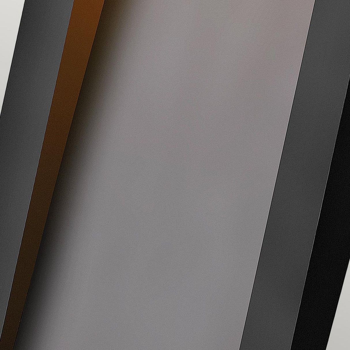 An image featuring a Taper Outdoor LED Large Wall Lantern in black, with a design of three parallel bars in shades of gray and black, reminiscent of modern exterior fixtures. The sleek style stands out against a muted gradient backdrop, emphasizing the geometric allure of outdoor lighting.