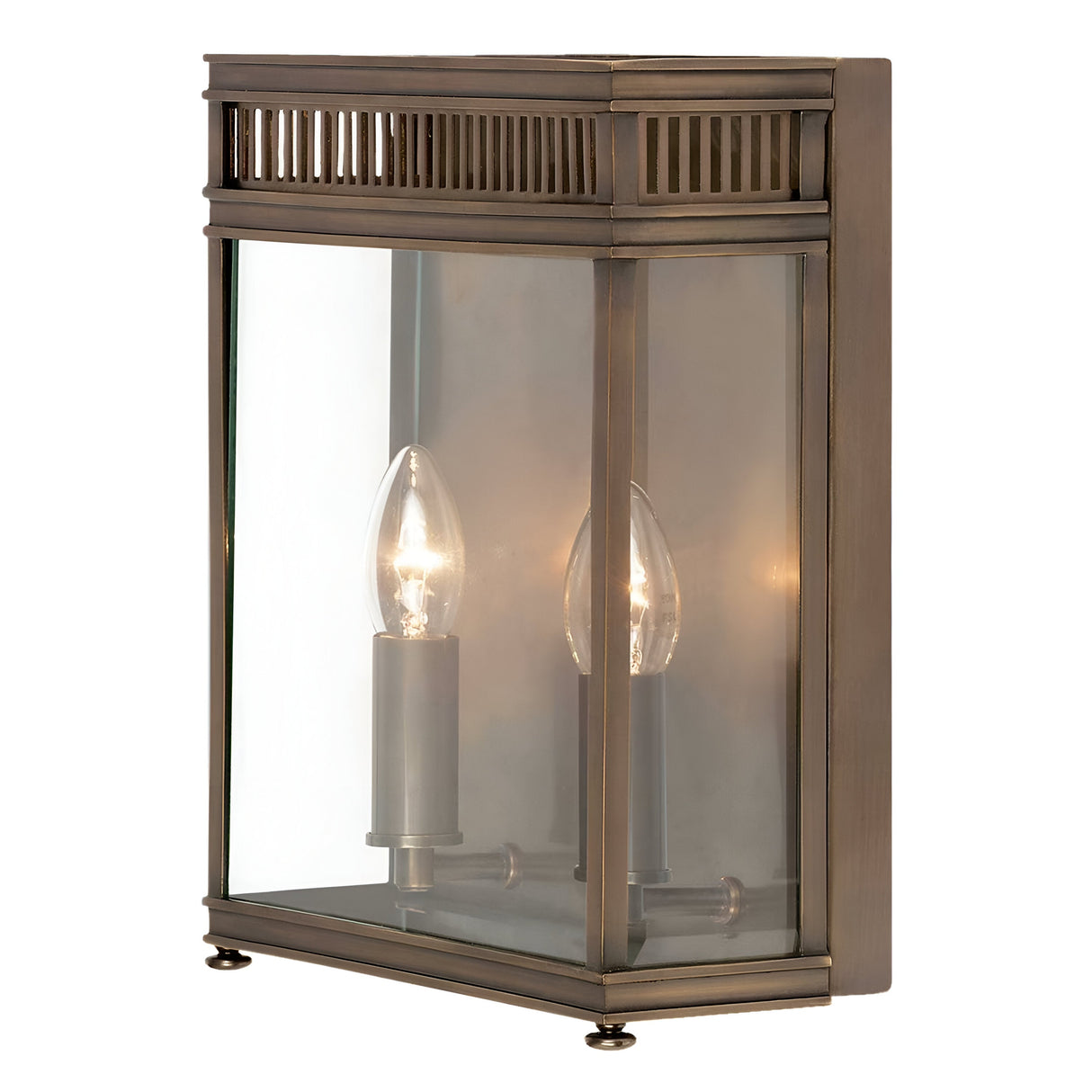 The Holborn 2 Light Outdoor Wall Light in dark bronze features a rectangular design with a clear glass cover, revealing two candle-shaped bulbs inside. Made from solid brass, its top boasts a slatted design that enhances its vintage appeal.