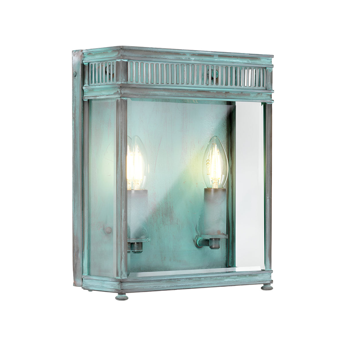 The Holborn 2 Light Outdoor Wall Light - Verdigris features a vintage-style design with a rectangular metal frame and two exposed bulbs. Made from solid brass, it exudes rustic charm with a turquoise patina in its verdigris finish. The bulbs are elegantly enclosed behind a glass panel.