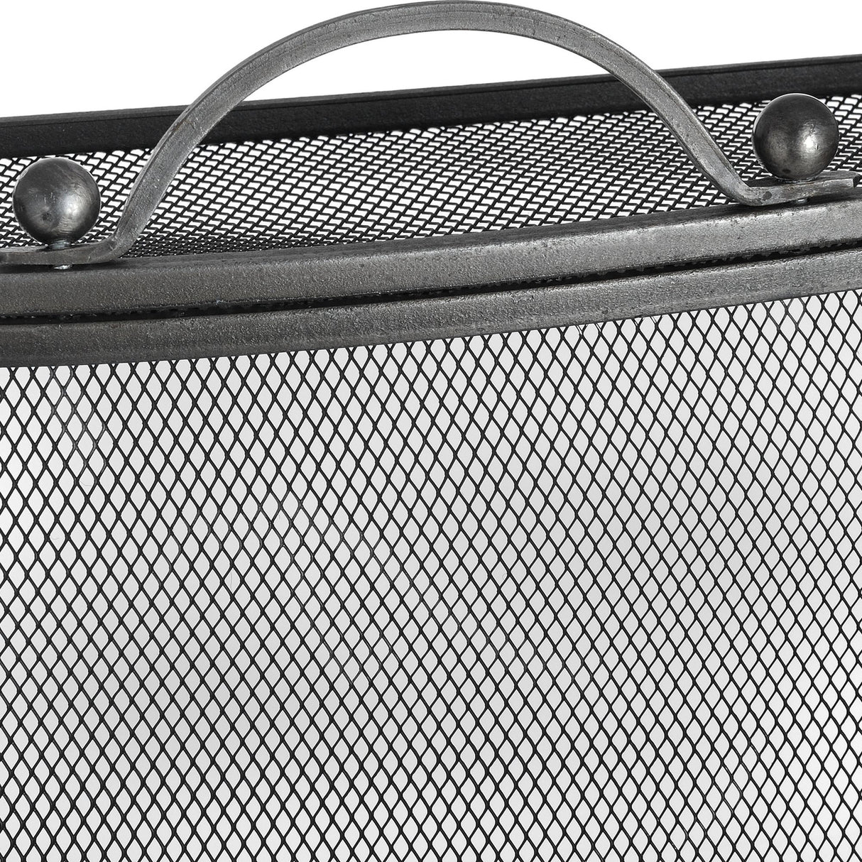 Close-up of Hill Interiors mesh fireguard showing the antique pewter effect top rail, arched handle and ball finials above the fine wire screen.