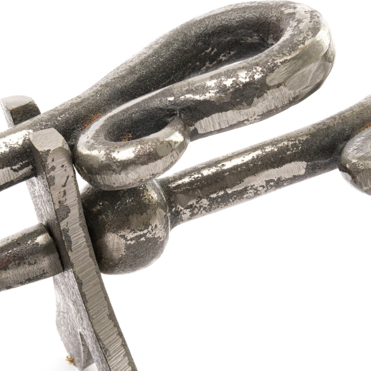 Close-up of the Hill Interiors Antique Pewter Crook Handled Hearth Tidy, showing the arched metal handle and pin detail in a weathered silver finish.