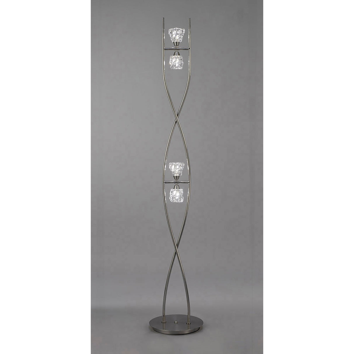 The Iku 4 Light Floor Lamp - Satin Nickel features a twisting metal frame with four vertically arranged glass bulb holders, showcasing a modern design.