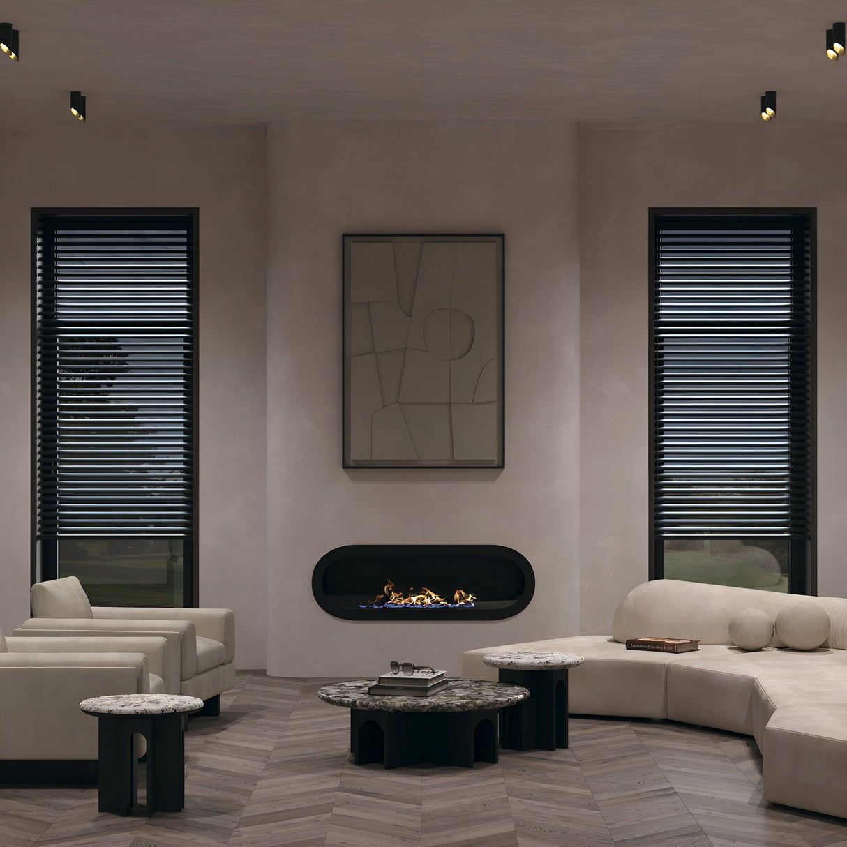 A minimalist modern living room showcases a built-in fireplace beneath abstract art, surrounded by beige sofas and armchairs with two round marble coffee tables. Large windows with black blinds and Lipari Short Surface Mounted Downlights 15cm in Black & Gold enhance the light and style.