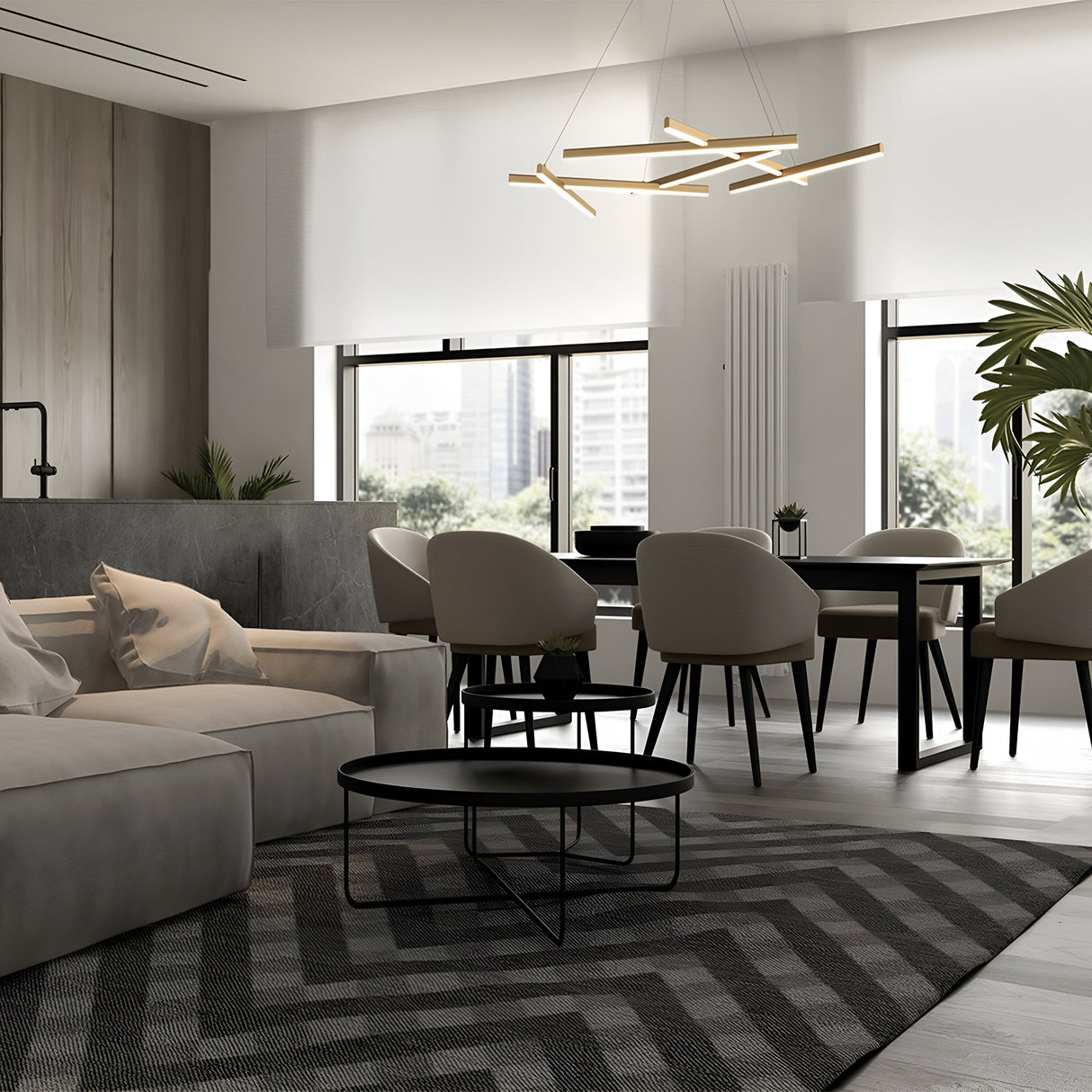 A modern living and dining area features a beige sectional sofa, black round coffee tables, gray patterned rug, and a black dining table with beige chairs. Large windows offer city views while the Line LED Suspension Light 3000K - Matte Gold hangs above.