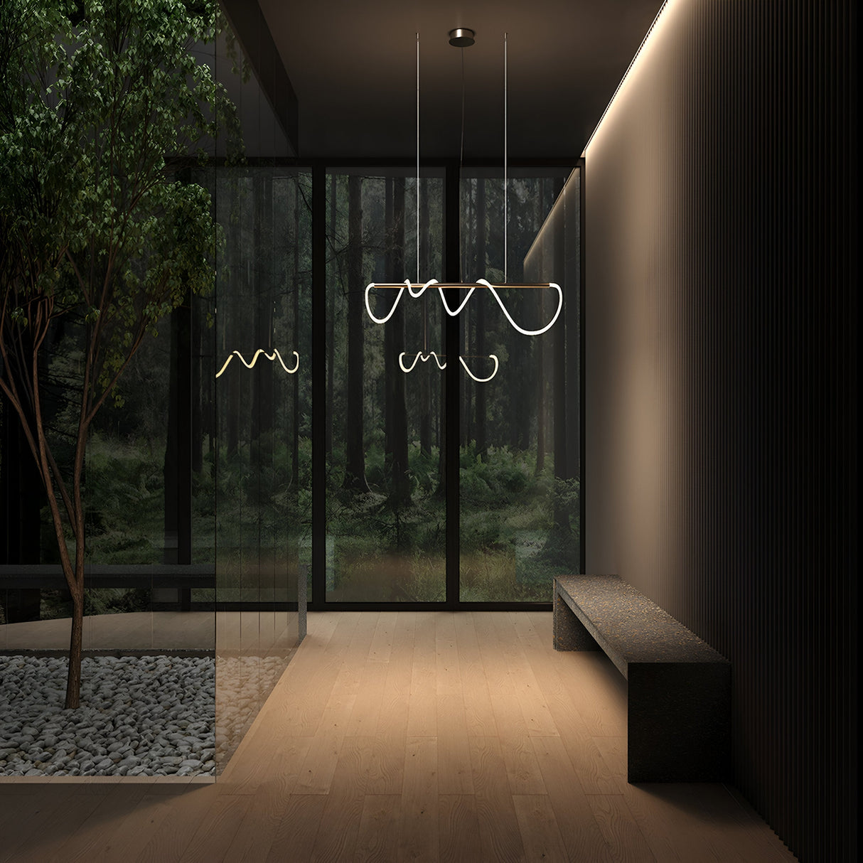 A modern interior features large floor-to-ceiling windows, a tree in a stone planter, a minimalist bench, and artistic hanging lights with gold accents. The serene, natural ambiance is enhanced by the subtle glow of the Tau LED Linear Suspension Light 3000K 30W - Gold.