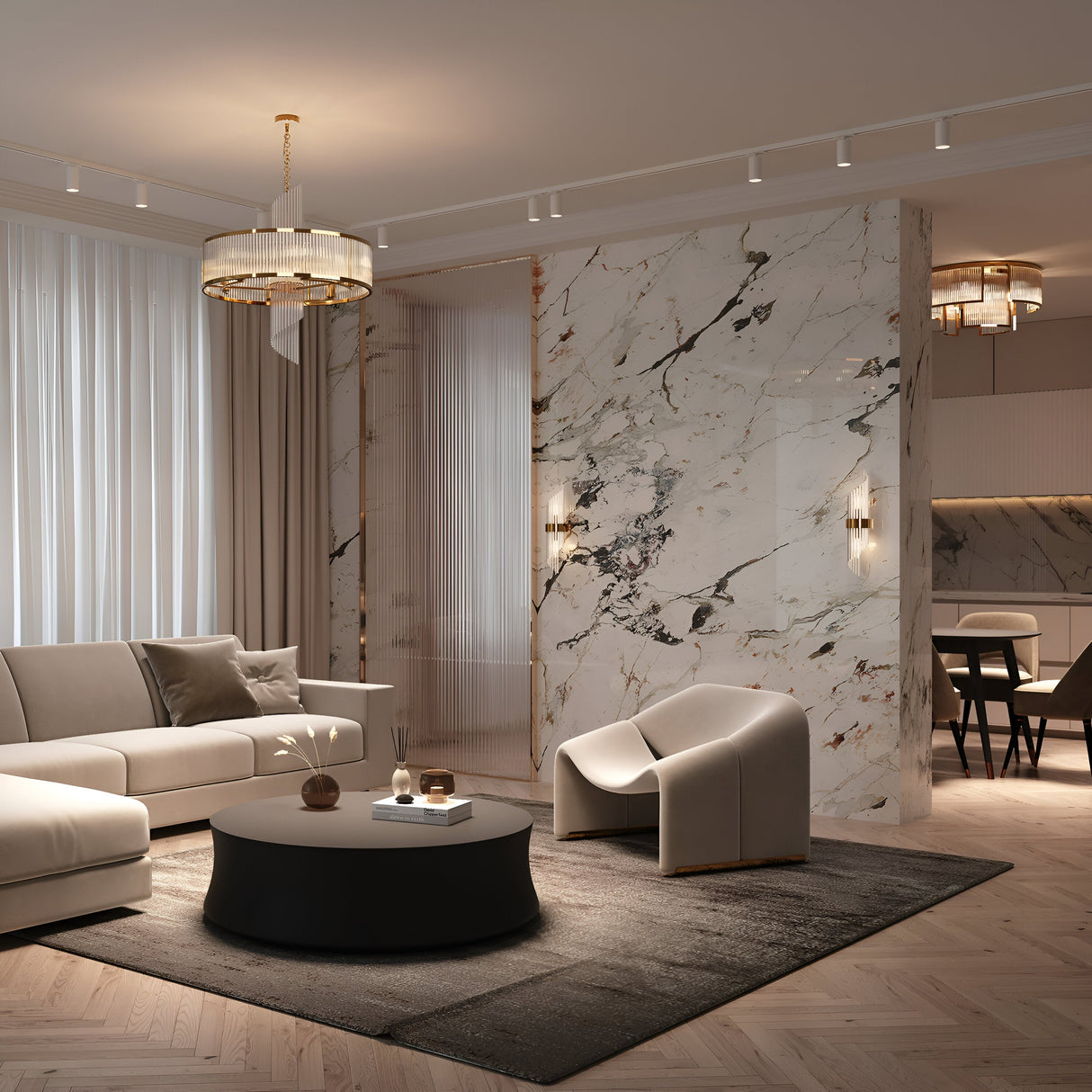 A modern living room features a beige sectional, a round black coffee table, and a sleek armchair. Gold accents complement marble wall panels while the Frame 6 Light Chandelier adds sparkle. Soft lighting highlights floor-to-ceiling curtains, enhancing the elegant minimalist decor.