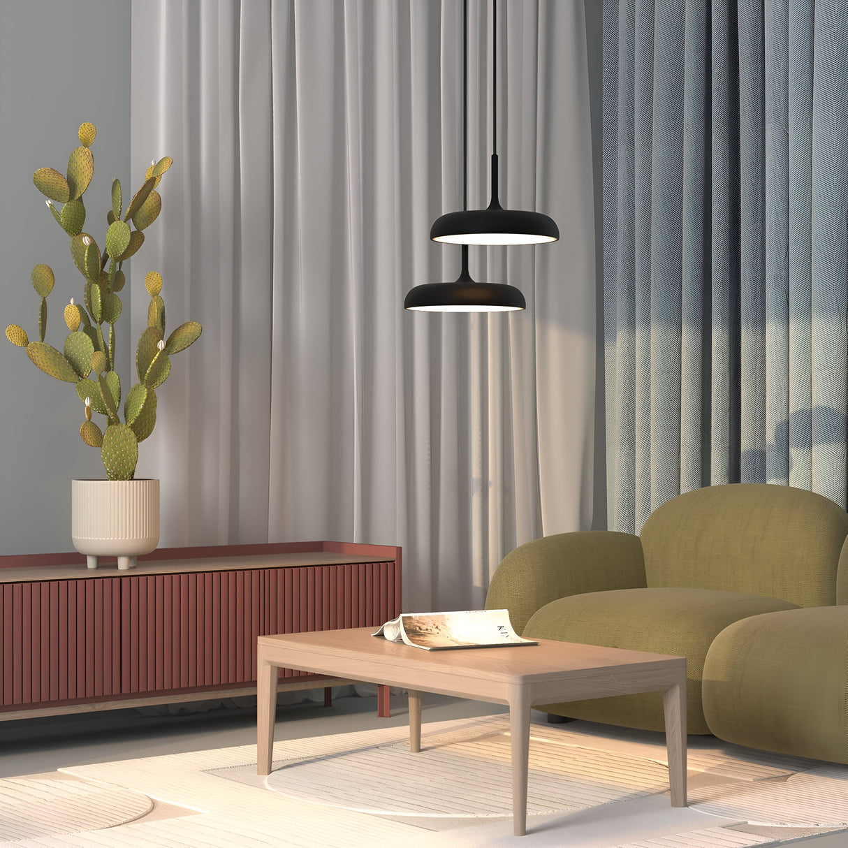 A modern living room features a green armchair, a wooden coffee table, and a red sideboard. Above the table, two Gerhard LED Dome Pendant Lights in black provide energy-efficient lighting. A tall cactus in a white pot adorns the sideboard as light gray and blue curtains frame the scene.
