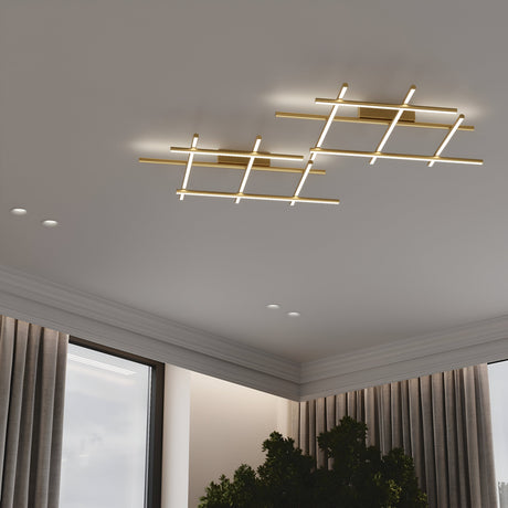 A modern rooms ceiling features two Radiance LED Ceiling Lights in a gold grid pattern with satin brass finish. Two recessed lights enhance the energy-efficient ambiance. Below, a window with curtains and green indoor plants is visible.