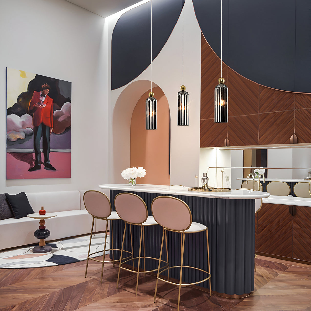 A modern interior features a chic bar area with three stools, pink cushions, and gold frames. Antic Pendant Lights in gold with grey ribbed glass illuminate the abstract textured wall. The vibrant painting and geometric patterns add to the rooms stylish design.