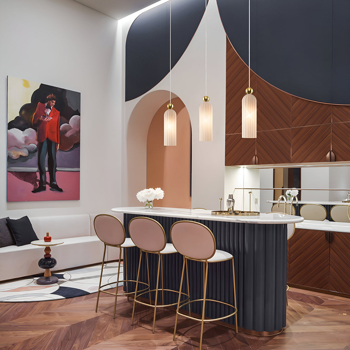 A modern interior with a sleek bar area featuring three tall chairs, a curved counter, and Antic Pendant Lights in gold with frosted ribbed glass. The walls showcase unique geometric designs in dark blue and wood textures, complemented by colorful artwork near a cushioned bench.