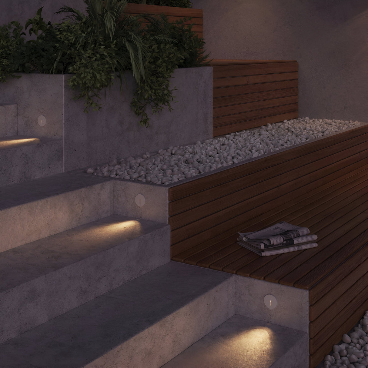 Concrete steps feature the stylish Lock Outdoor LED Recessed Wall Light in white, complemented by a wooden bench with white pebbles and a folded newspaper. Lush green plants in planter boxes enhance the serene ambiance with energy-efficient lighting.