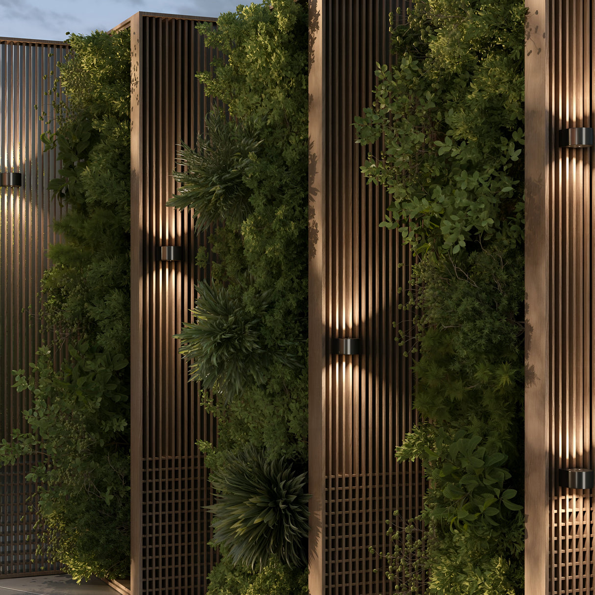 The Blow Outdoor LED Up and Down Wall Light - Graphite casts vibrant light on a lush vertical garden, accentuating plants against slatted wooden panels. Its IP54 rating assures durability, enhancing the natural aesthetic with soft, effective illumination.